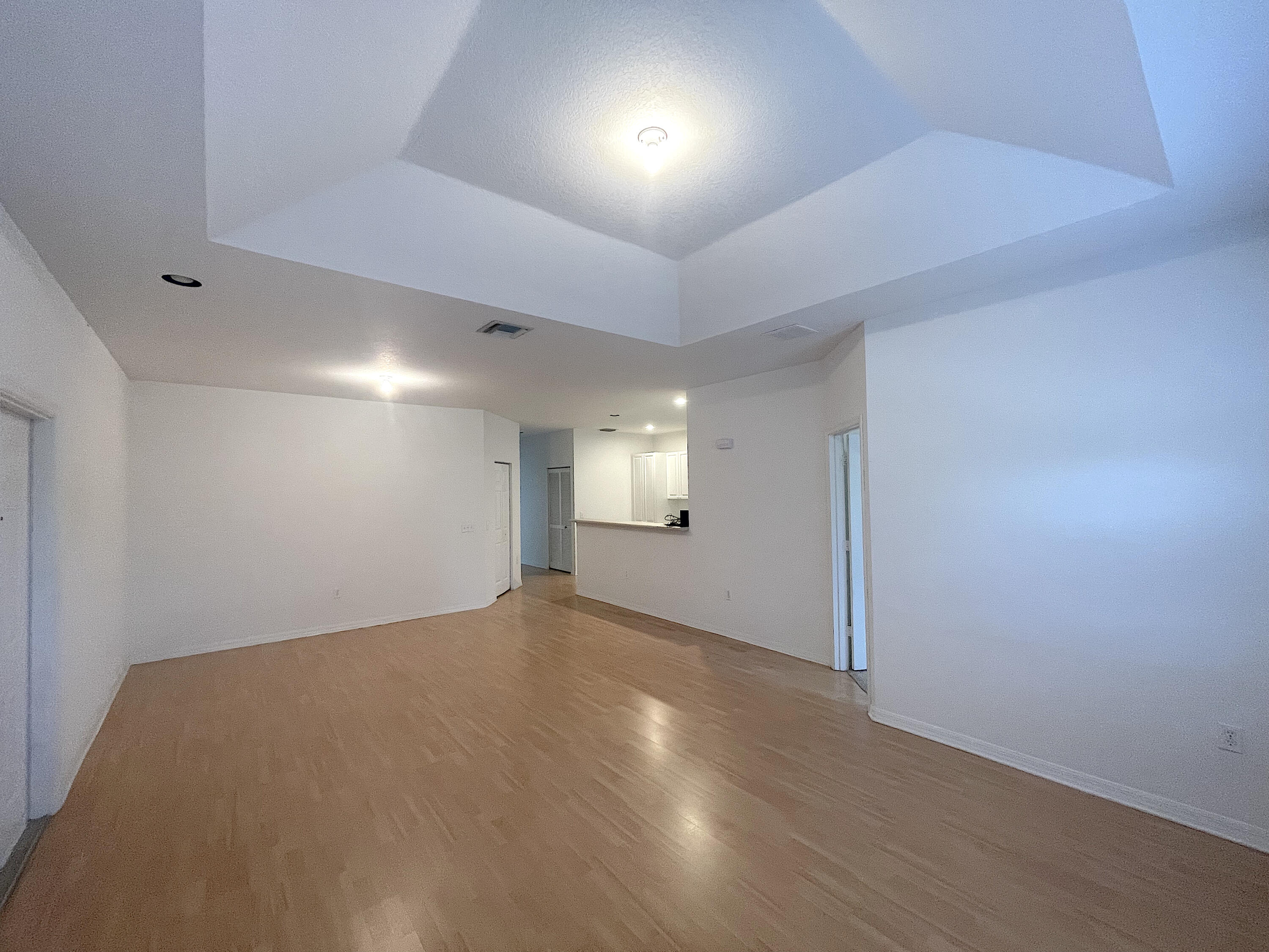 1791 Lakefront Boulevard, Unit 1 Fort Pierce, FL 34982 - Photo 3 of 14 an empty room with a empty space and windows