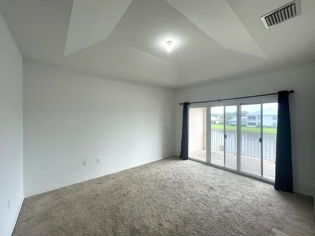a view of an empty room with a balcony