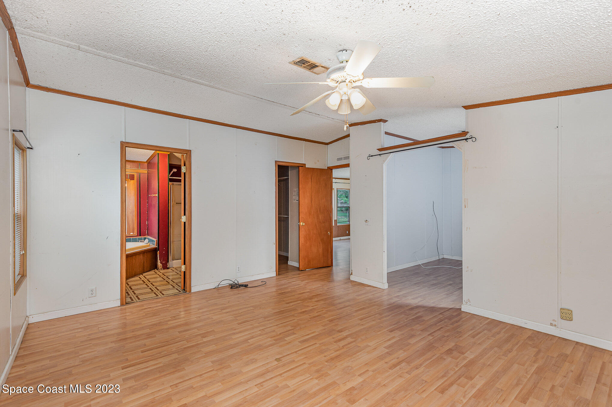 823 Phyllis Way Cocoa, FL 32926 - Photo 12 of 28 a view of an empty room with wooden floor