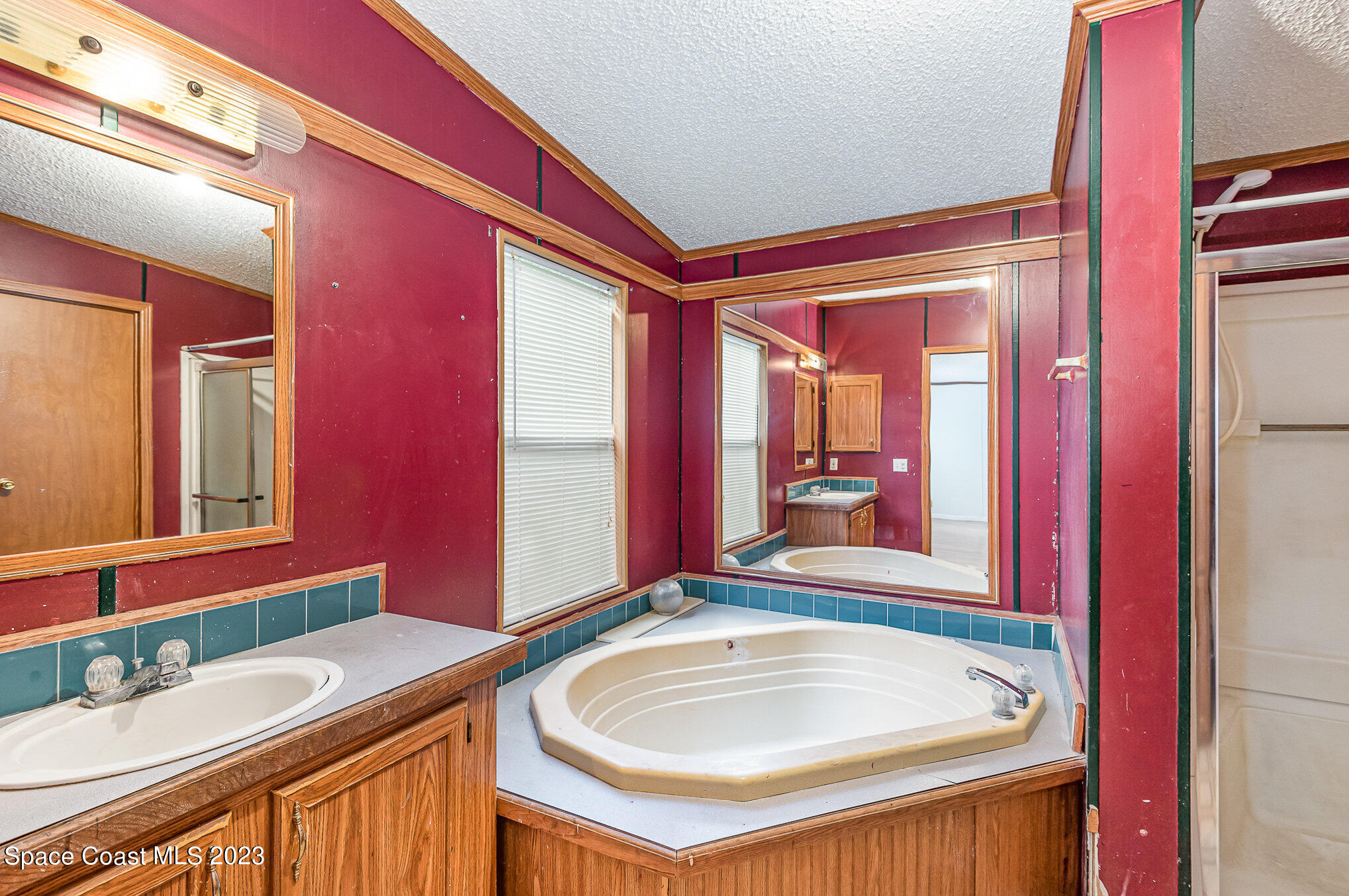 823 Phyllis Way Cocoa, FL 32926 - Photo 13 of 28 a bathroom with a sink and a mirror