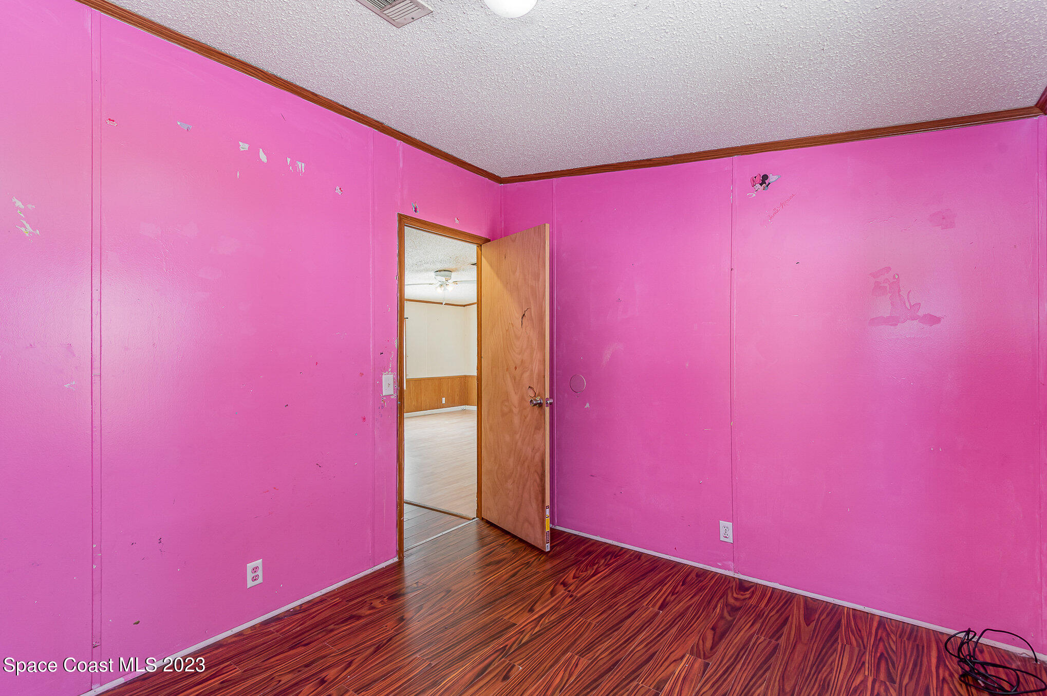 823 Phyllis Way Cocoa, FL 32926 - Photo 17 of 28 a view of empty room with wooden floor