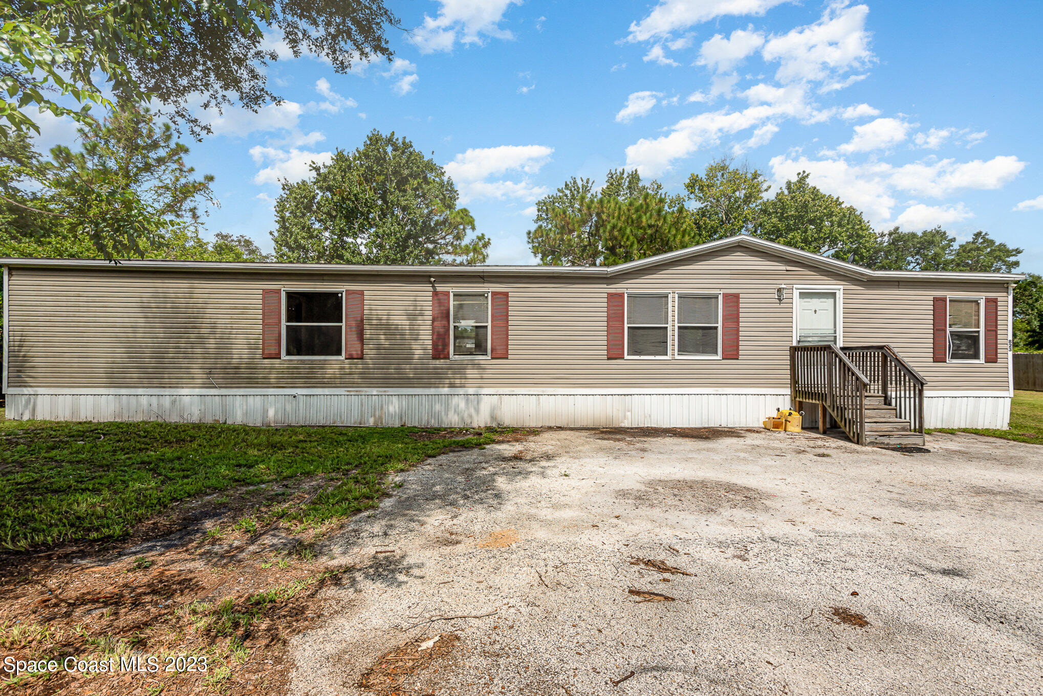 823 Phyllis Way Cocoa, FL 32926 - Photo 21 of 28 a view of a house with a backyard