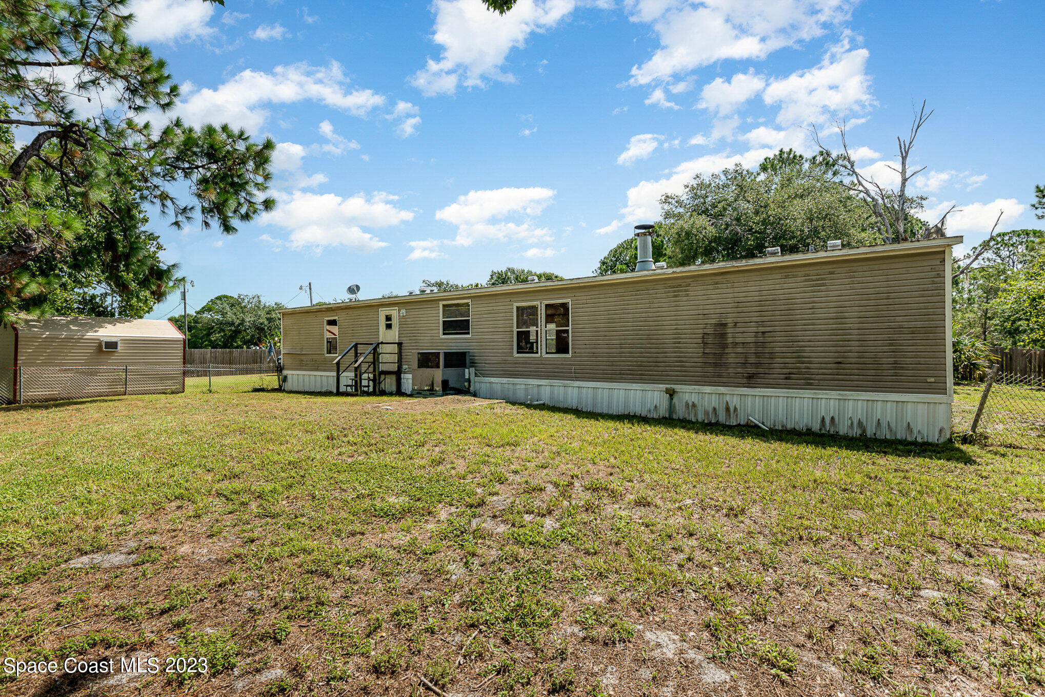 823 Phyllis Way Cocoa, FL 32926 - Photo 23 of 28 a backyard of a house