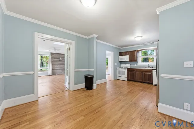 a view of kitchen with granite countertop cabinets and wooden floor