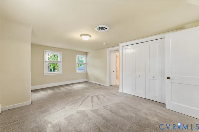 a view of an empty room and window