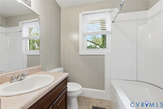 a bathroom with a sink a toilet and a bathtub