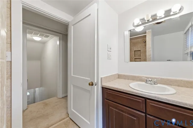 a bathroom with a sink and mirror