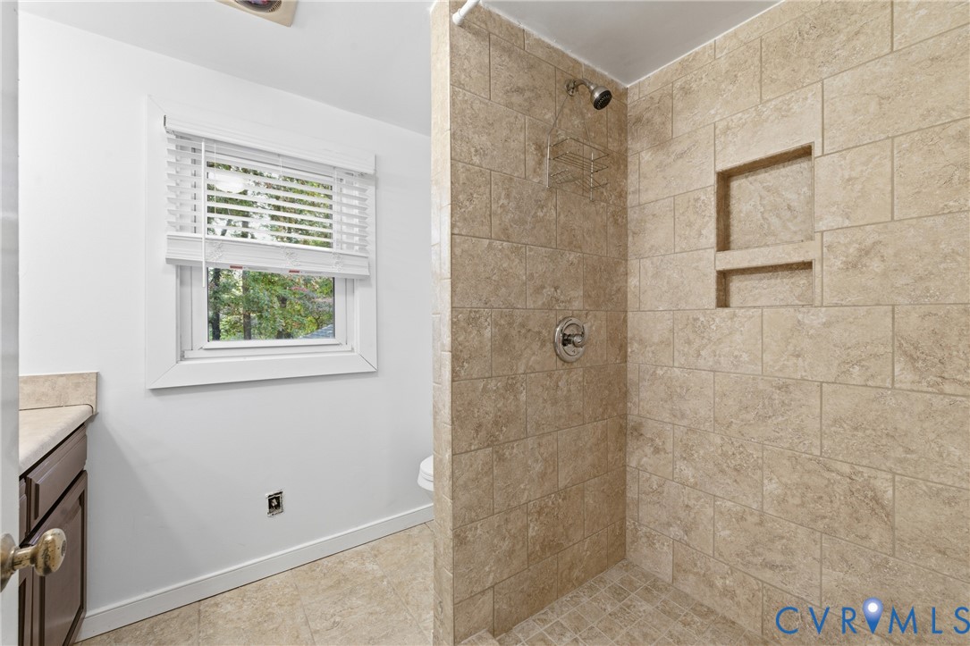 8325 Mill Creek Road West Point, VA 23181 - Photo 32 of 50 a bathroom with a window and a shower