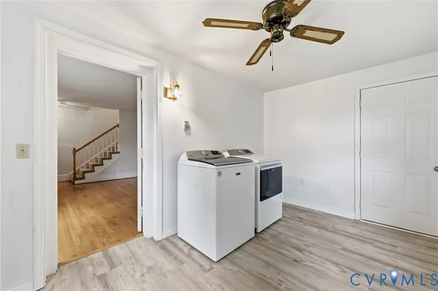 a view of kitchen with stainless steel appliances cabinets and wooden floor