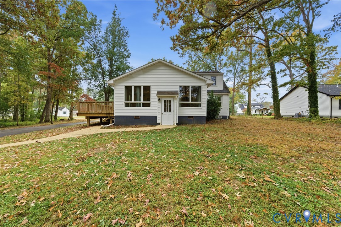 8325 Mill Creek Road West Point, VA 23181 - Photo 40 of 50 a front view of a house with yard and trees