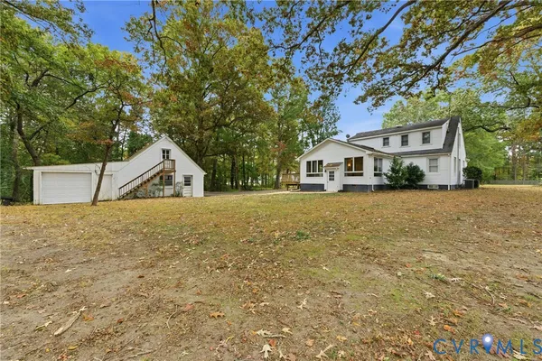 a house with trees in front of it
