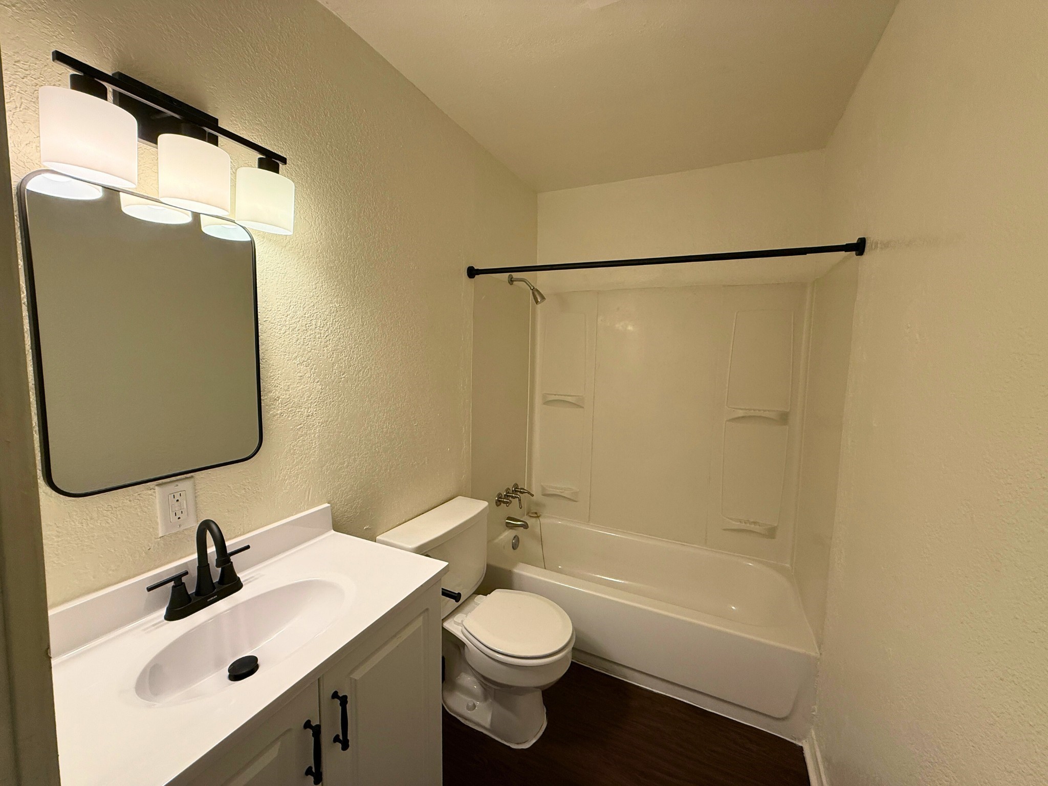 214 Crawford Street Huntsville, TX 77340 - Photo 11 of 24 a bathroom with a sink toilet and shower