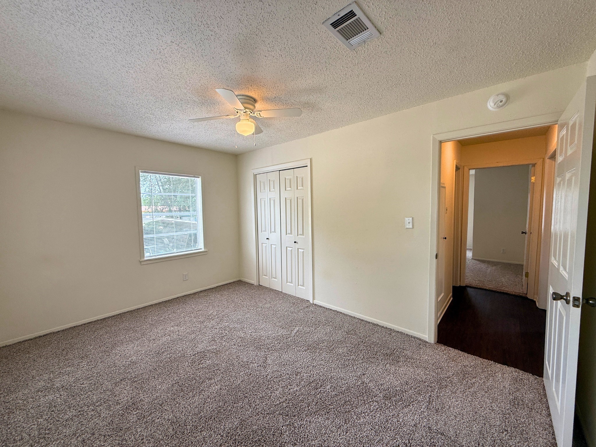 214 Crawford Street Huntsville, TX 77340 - Photo 24 of 24 an empty room with windows and fan