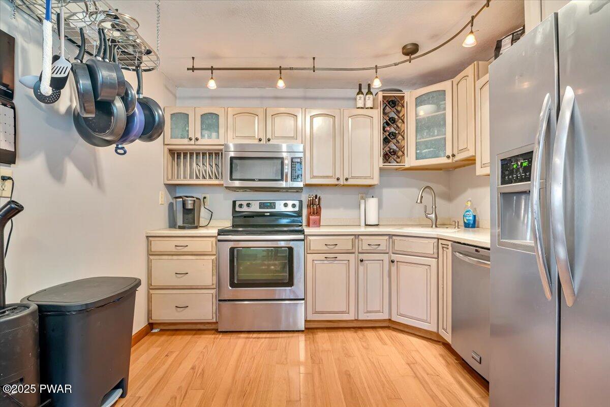 192 Heather Hill Road Dingmans Ferry, PA 18328 - Photo 12 of 74 a kitchen with stainless steel appliances granite countertop a refrigerator and a stove