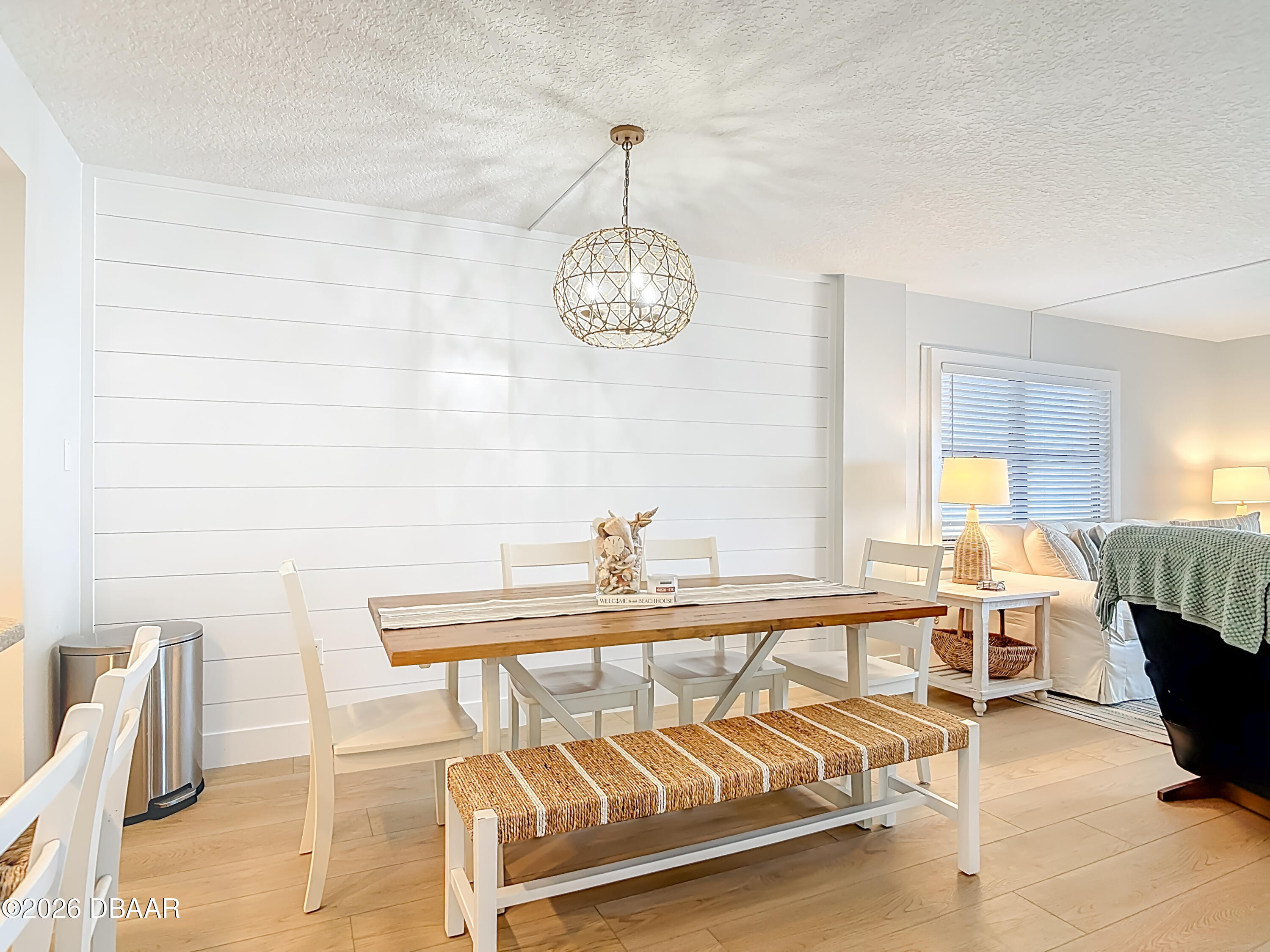 4445 South Atlantic Avenue, Unit 301 Ponce Inlet, FL 32127 - Photo 11 of 45 a view of a dining room with furniture window and outside view