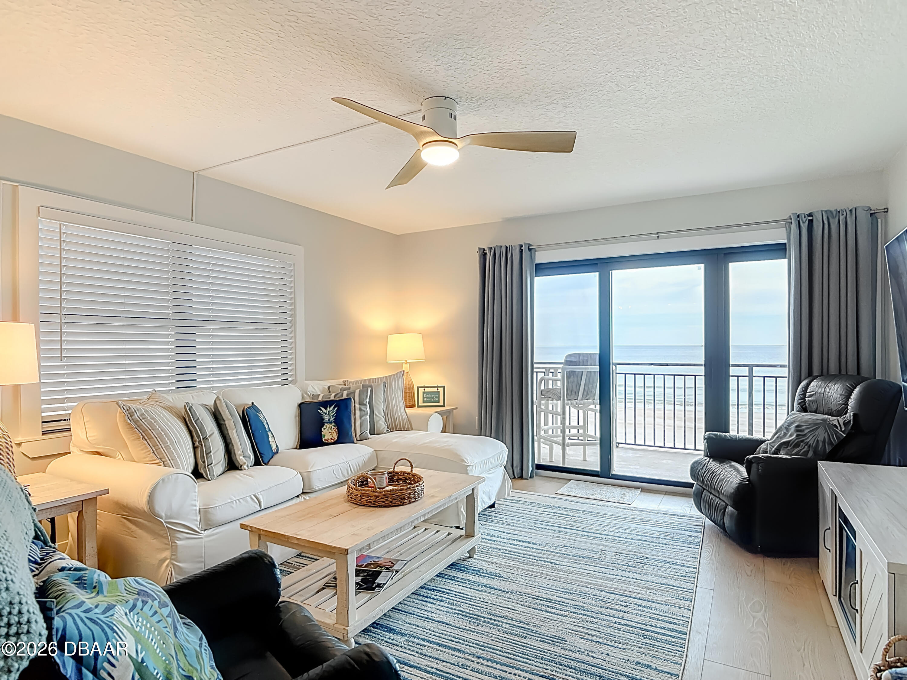 4445 South Atlantic Avenue, Unit 301 Ponce Inlet, FL 32127 - Photo 14 of 45 a bedroom with furniture and a large window