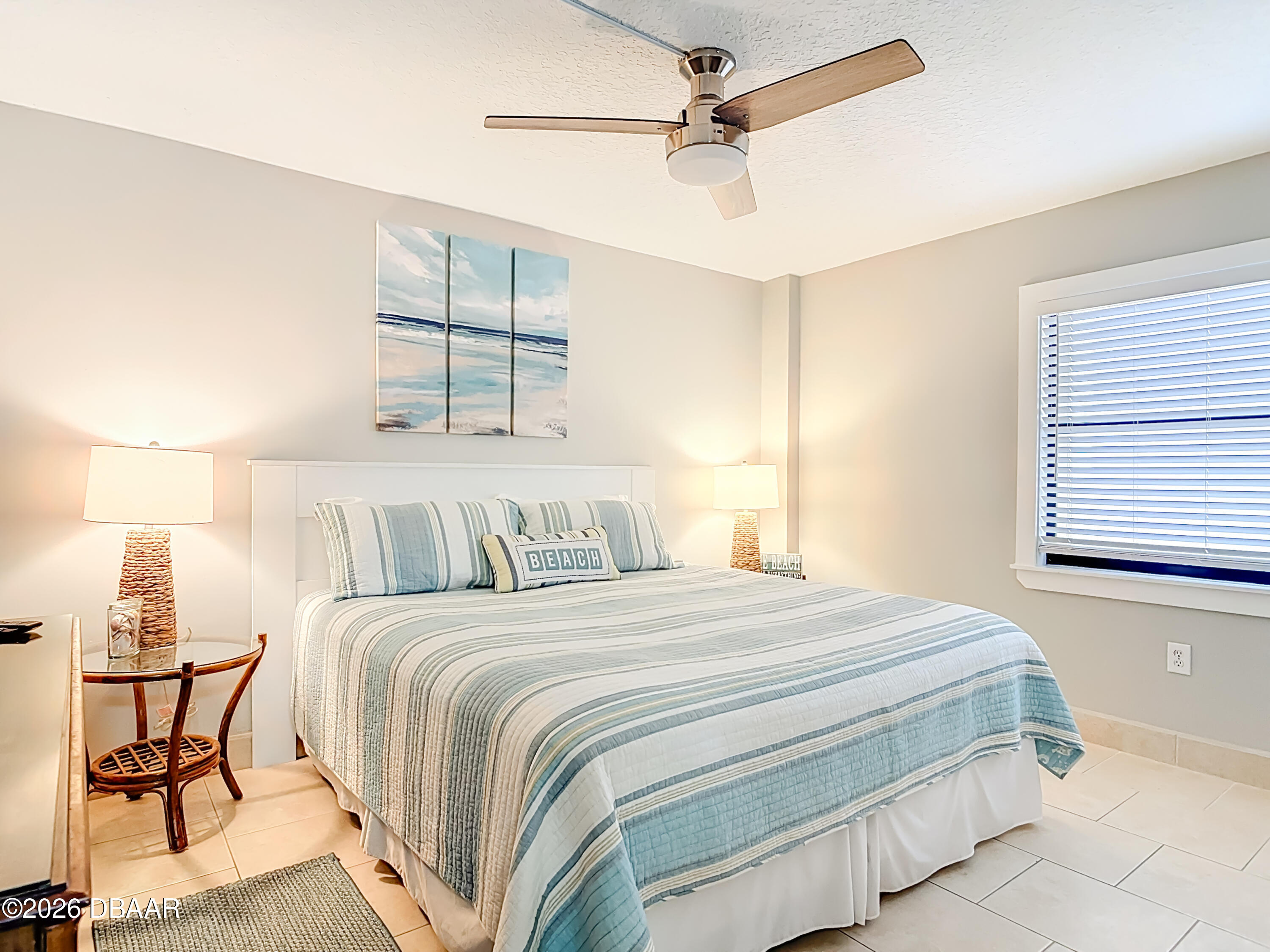 4445 South Atlantic Avenue, Unit 301 Ponce Inlet, FL 32127 - Photo 19 of 45 a bedroom with a bed and window