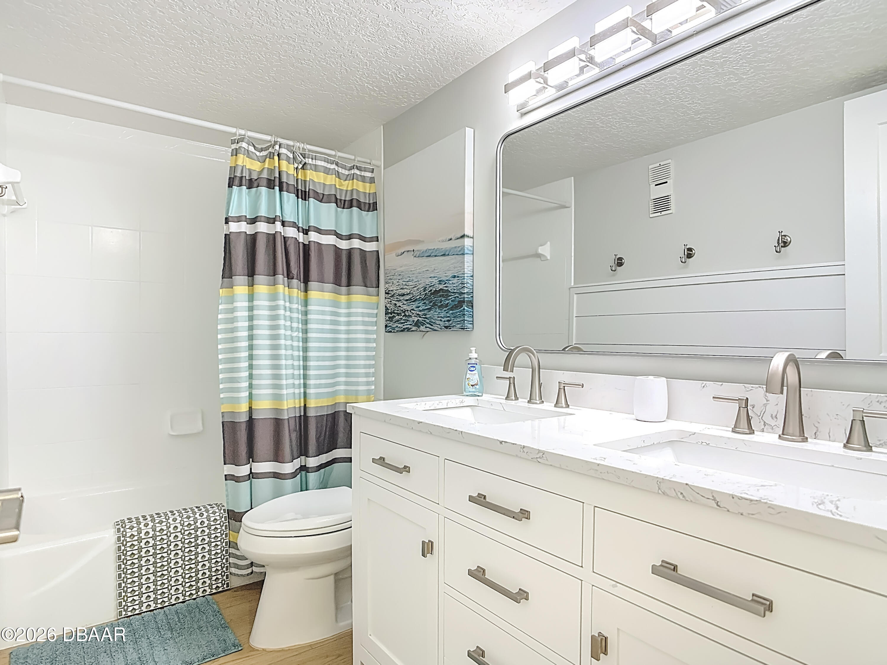 4445 South Atlantic Avenue, Unit 301 Ponce Inlet, FL 32127 - Photo 25 of 45 a bathroom with a sink a toilet and shower