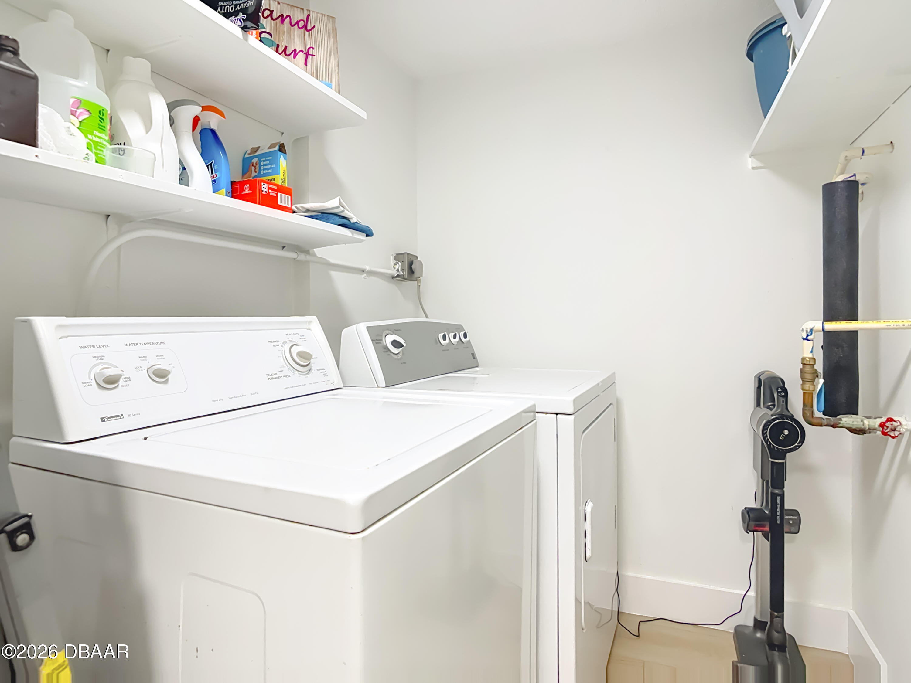 4445 South Atlantic Avenue, Unit 301 Ponce Inlet, FL 32127 - Photo 31 of 45 a utility room with dryer and washer