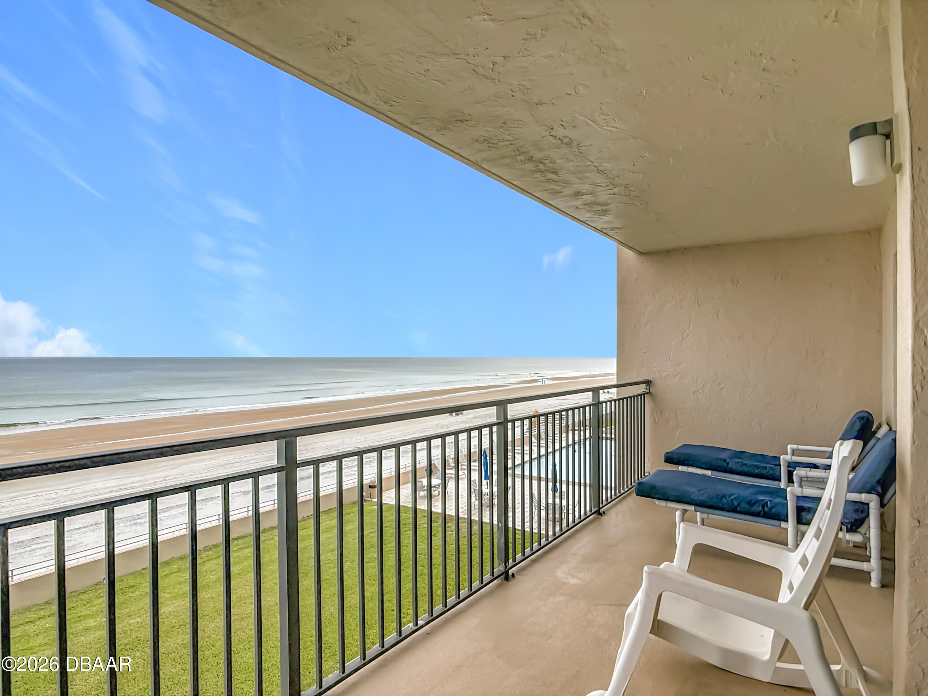4445 South Atlantic Avenue, Unit 301 Ponce Inlet, FL 32127 - Photo 32 of 45 a view of a balcony with chairs