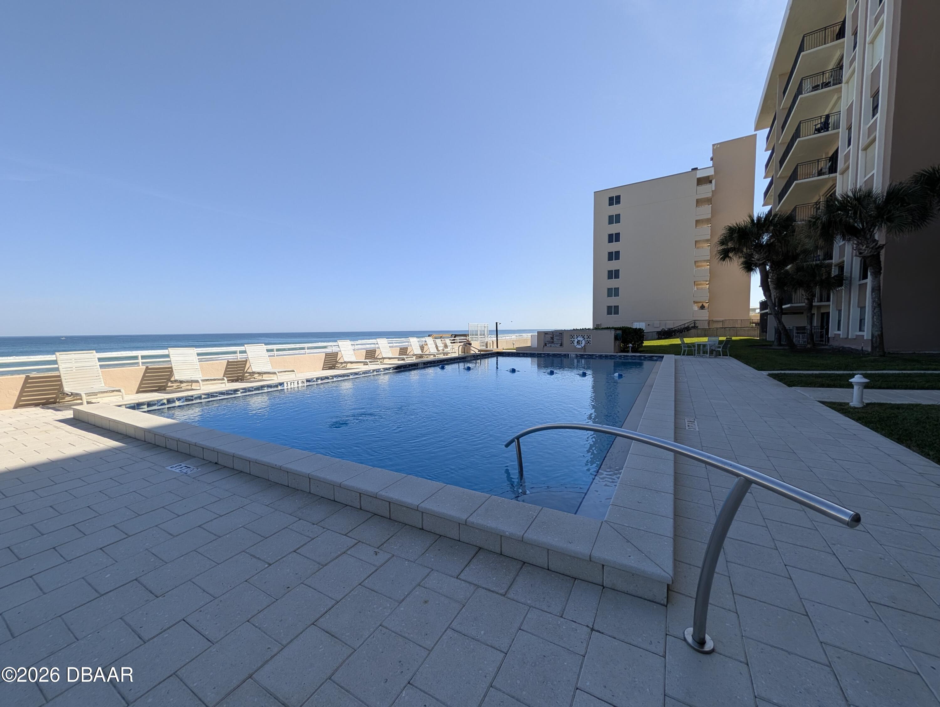 4445 South Atlantic Avenue, Unit 301 Ponce Inlet, FL 32127 - Photo 35 of 45 a view of outdoor space with swimming pool and seating
