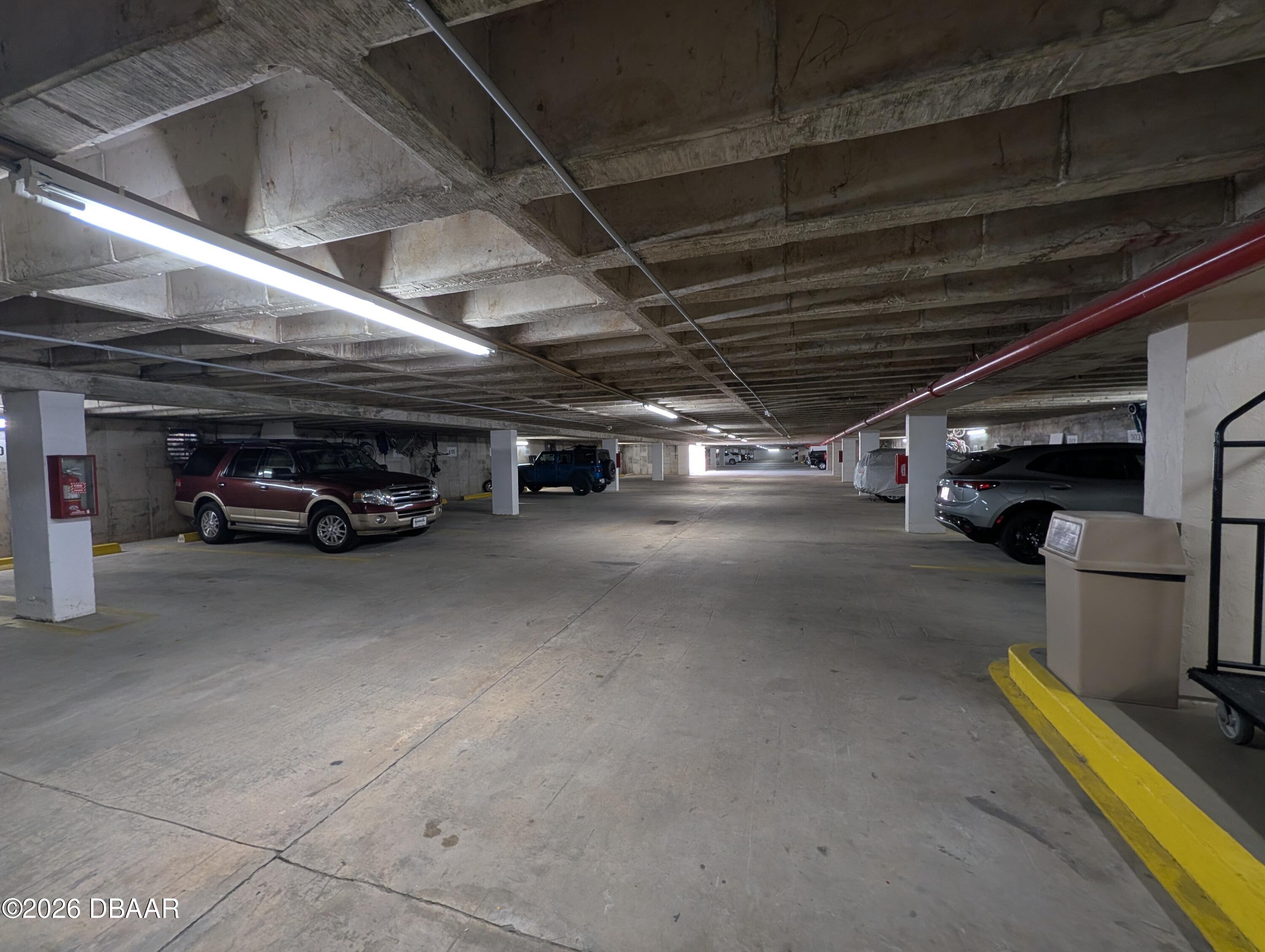 4445 South Atlantic Avenue, Unit 301 Ponce Inlet, FL 32127 - Photo 38 of 45 a car parked in parking area