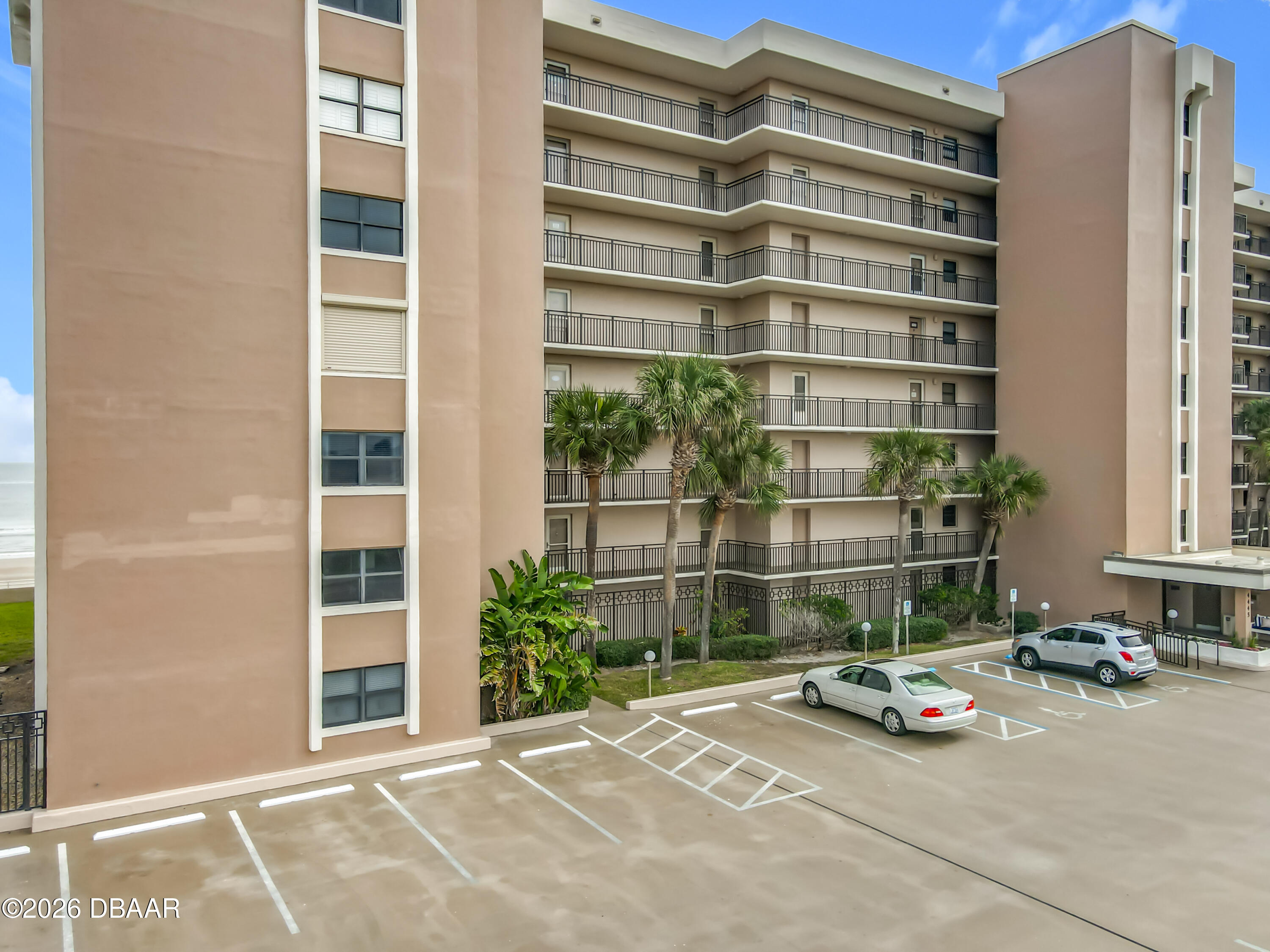 4445 South Atlantic Avenue, Unit 301 Ponce Inlet, FL 32127 - Photo 42 of 45 a view of a building with a potted plant and a window