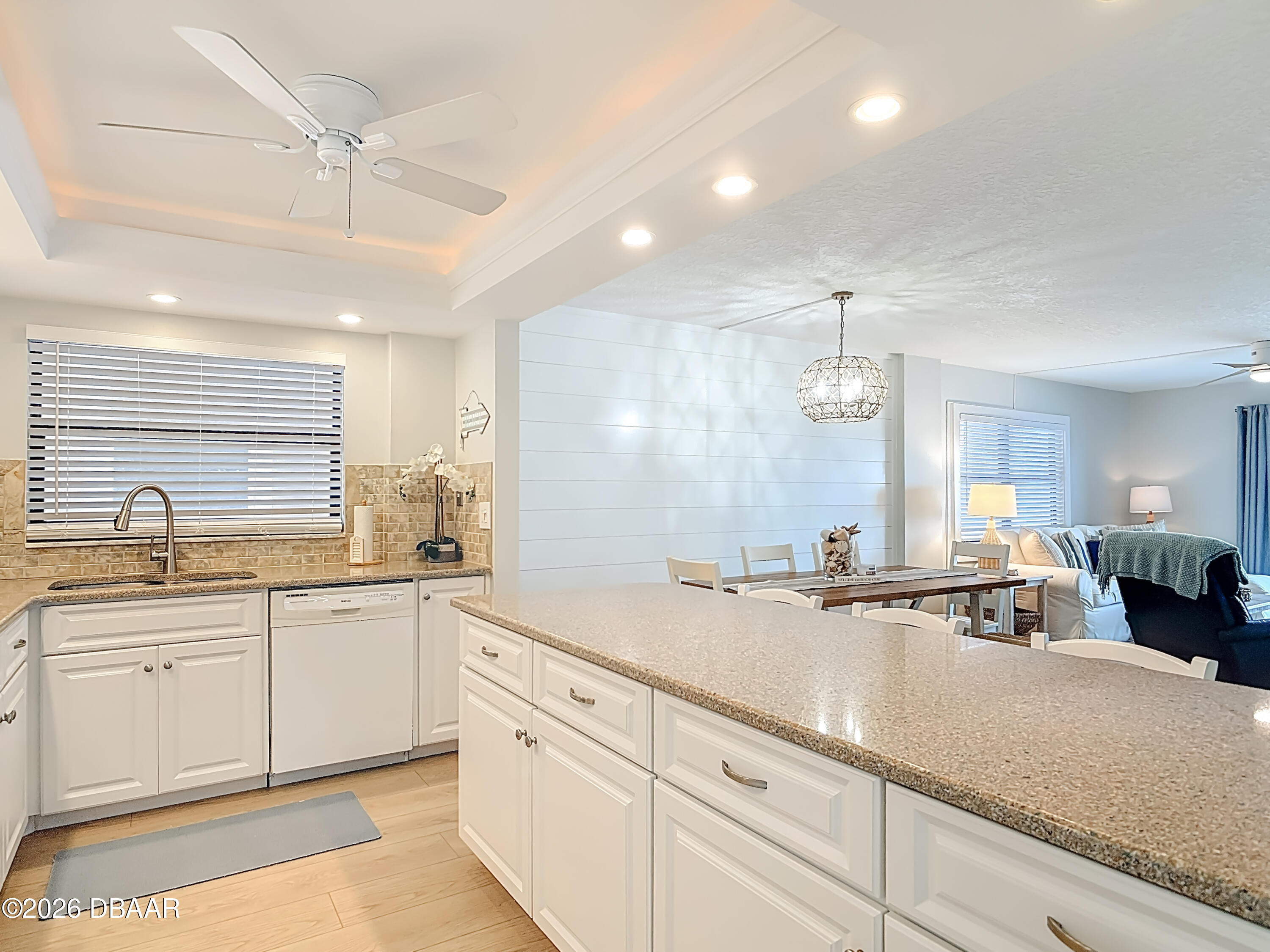 4445 South Atlantic Avenue, Unit 301 Ponce Inlet, FL 32127 - Photo 5 of 45 a large kitchen with a sink and cabinets