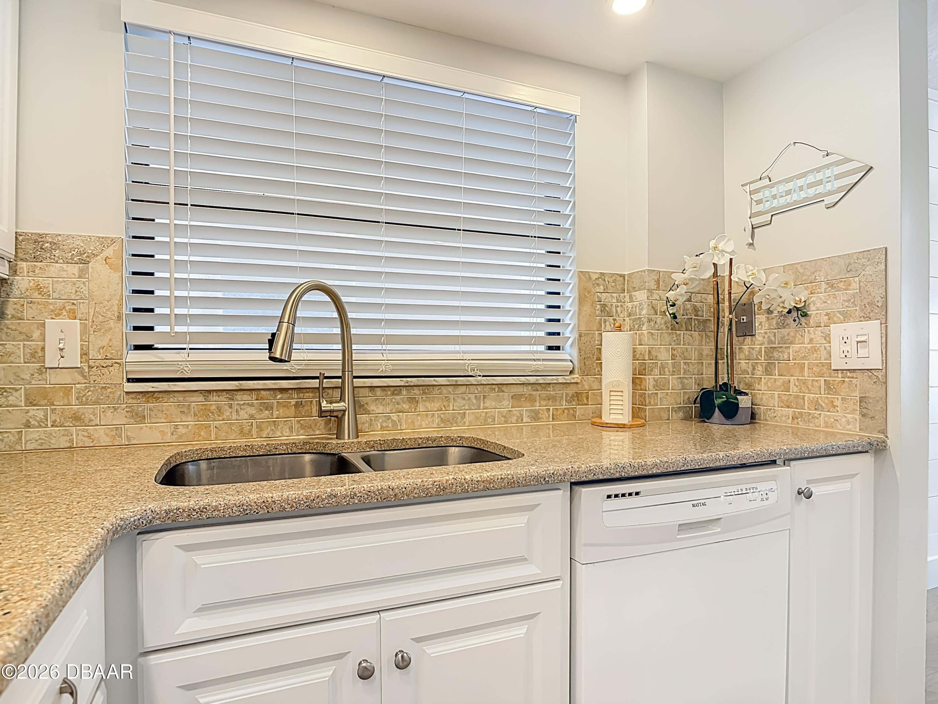 4445 South Atlantic Avenue, Unit 301 Ponce Inlet, FL 32127 - Photo 7 of 45 a close view of sink and tap