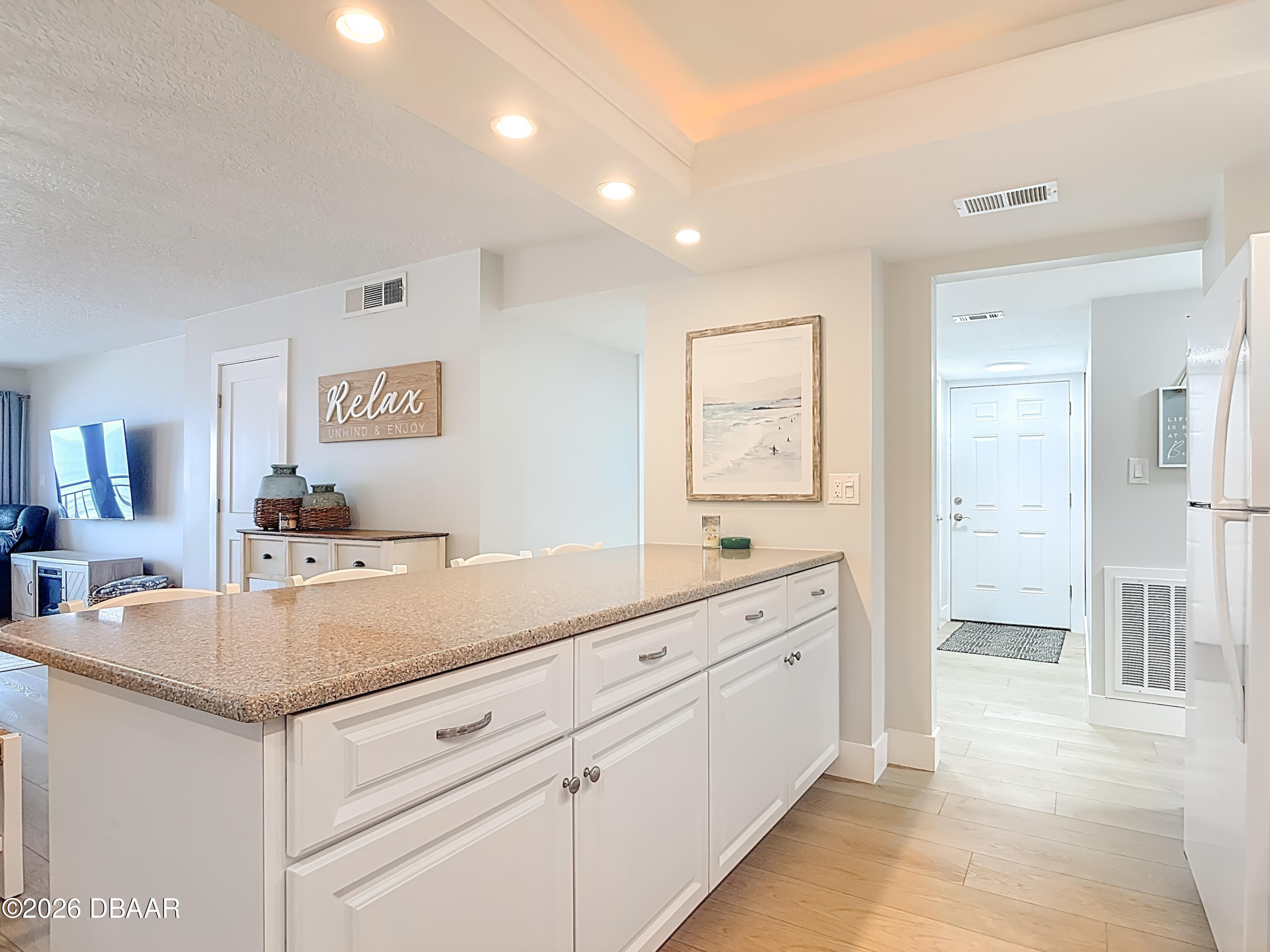 4445 South Atlantic Avenue, Unit 301 Ponce Inlet, FL 32127 - Photo 8 of 45 a view with cabinets and sink