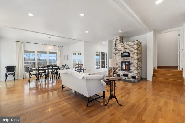 a living room with furniture a fireplace and a fireplace
