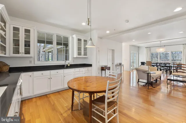 a spacious bathroom with a bathtub shower and a sink