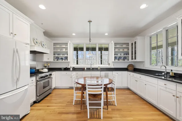 a room with a mirror and a sink