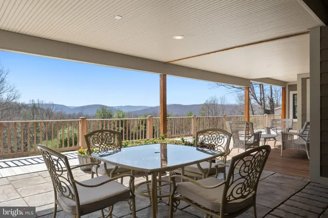 a bedroom with two beds and a couch