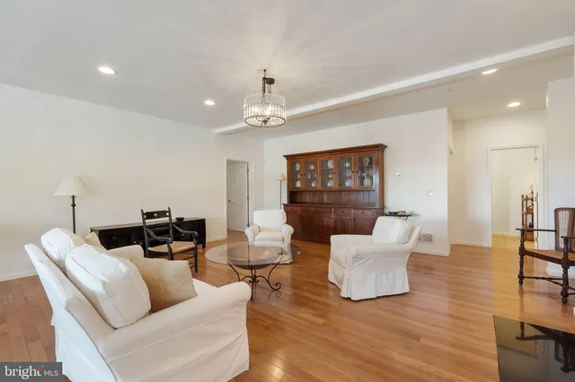 a workspace with wooden floor and a rug