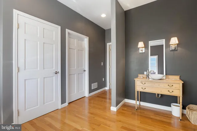 a view of a patio with a dining table and chairs with wooden floor