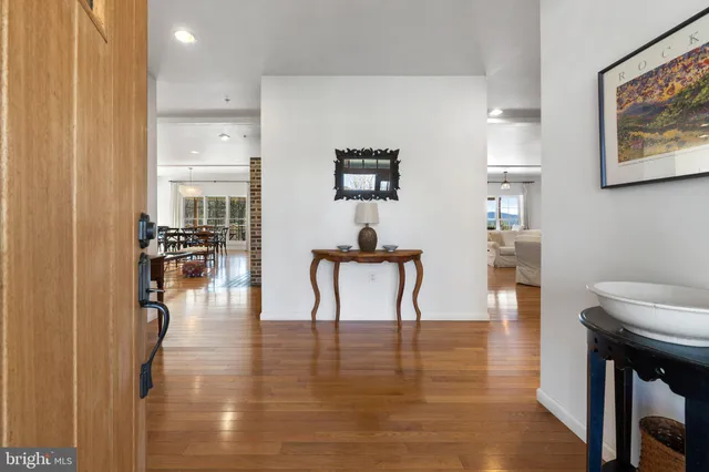 a room with furniture a rug toys and a book shelf