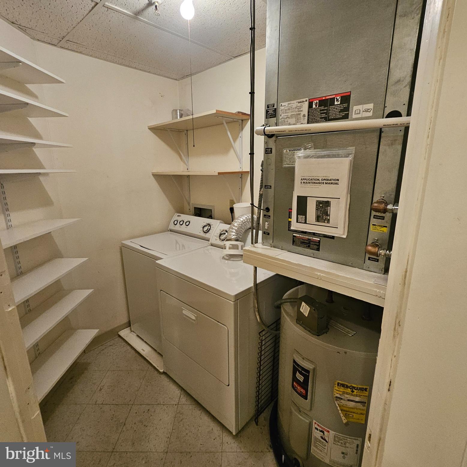 3801 Canterbury Road, Unit 618 Baltimore, MD 21218 - Photo 24 of 29 Full Utility Room With Washer & Dryer
