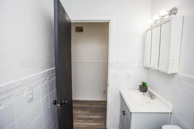 a bathroom with a sink and mirror
