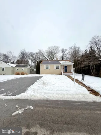 a view of a road with a house