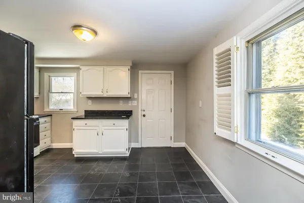 a kitchen with a stove a sink and a refrigerator