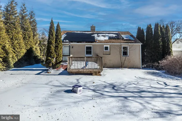 a view of a house with basketball court