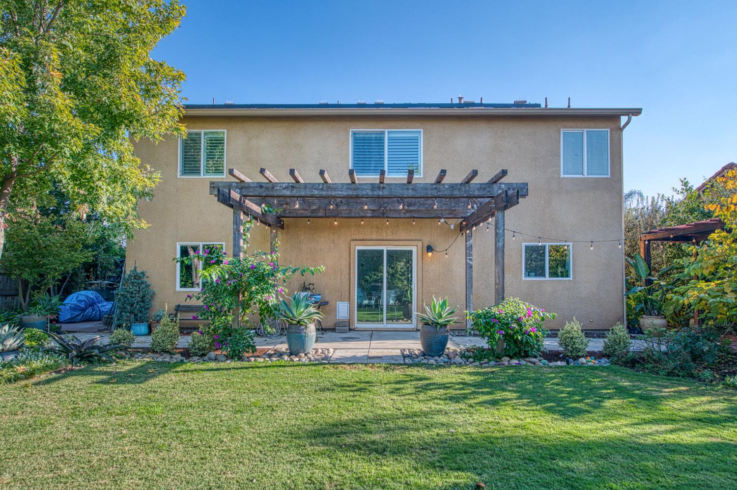 5855 East Platt Avenue Fresno, CA 93727 - Photo 11 of 57 a front view of a house with a yard