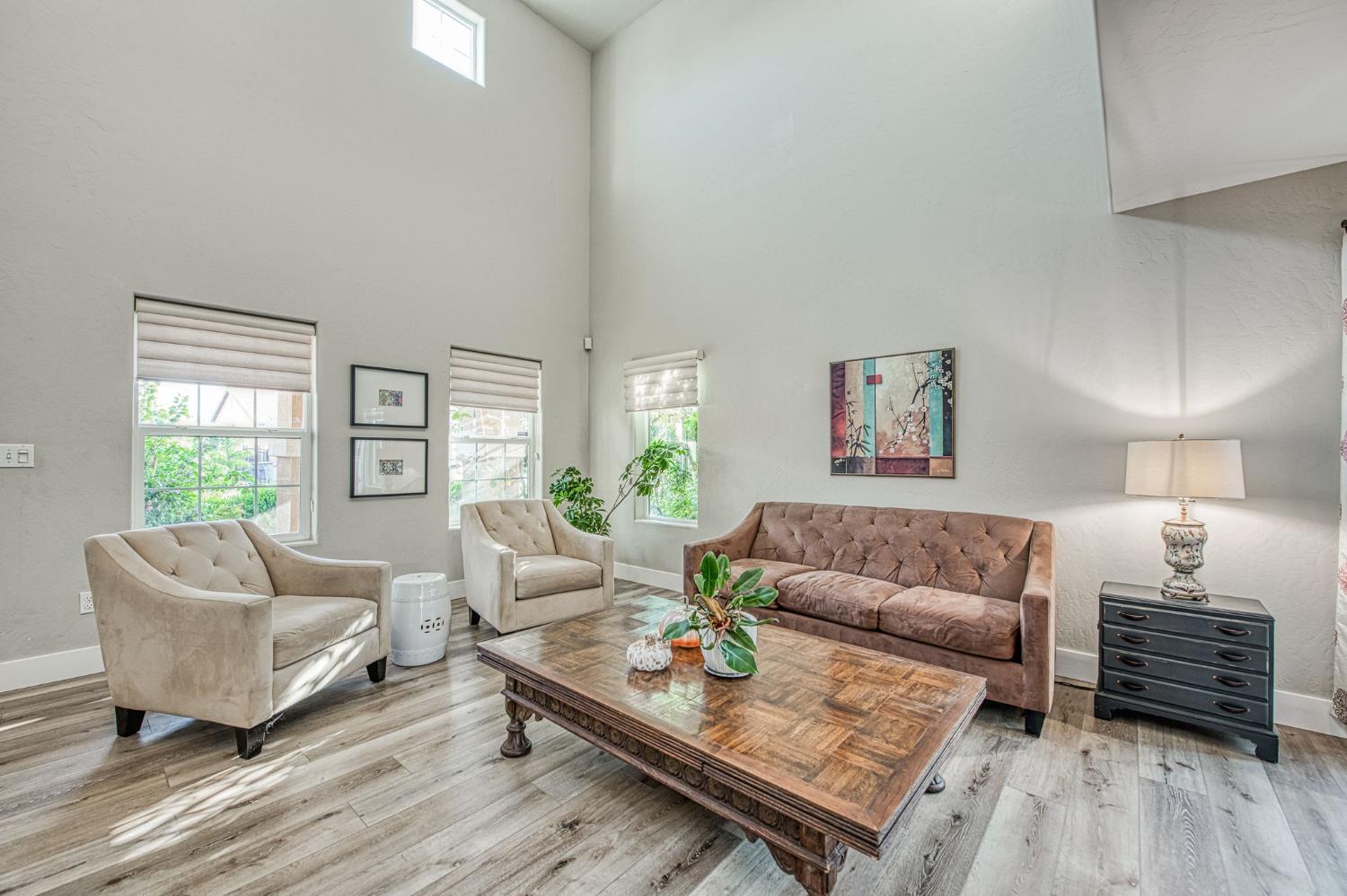5855 East Platt Avenue Fresno, CA 93727 - Photo 18 of 57 a living room with furniture a bed and a couch