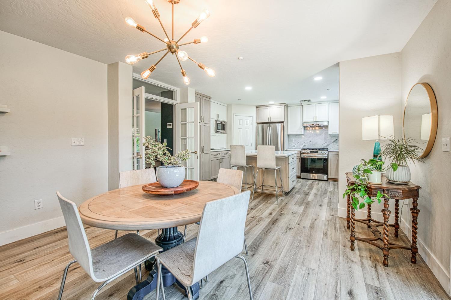 5855 East Platt Avenue Fresno, CA 93727 - Photo 28 of 57 a view of a dining room with furniture and wooden floor
