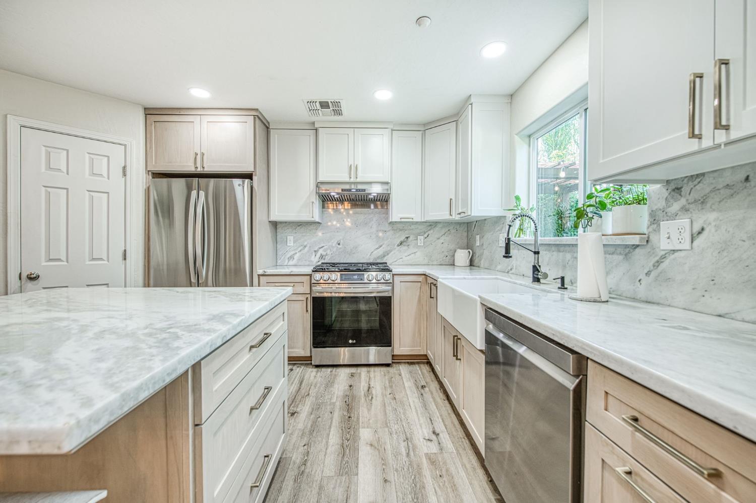 5855 East Platt Avenue Fresno, CA 93727 - Photo 30 of 57 a kitchen with a sink stove and refrigerator