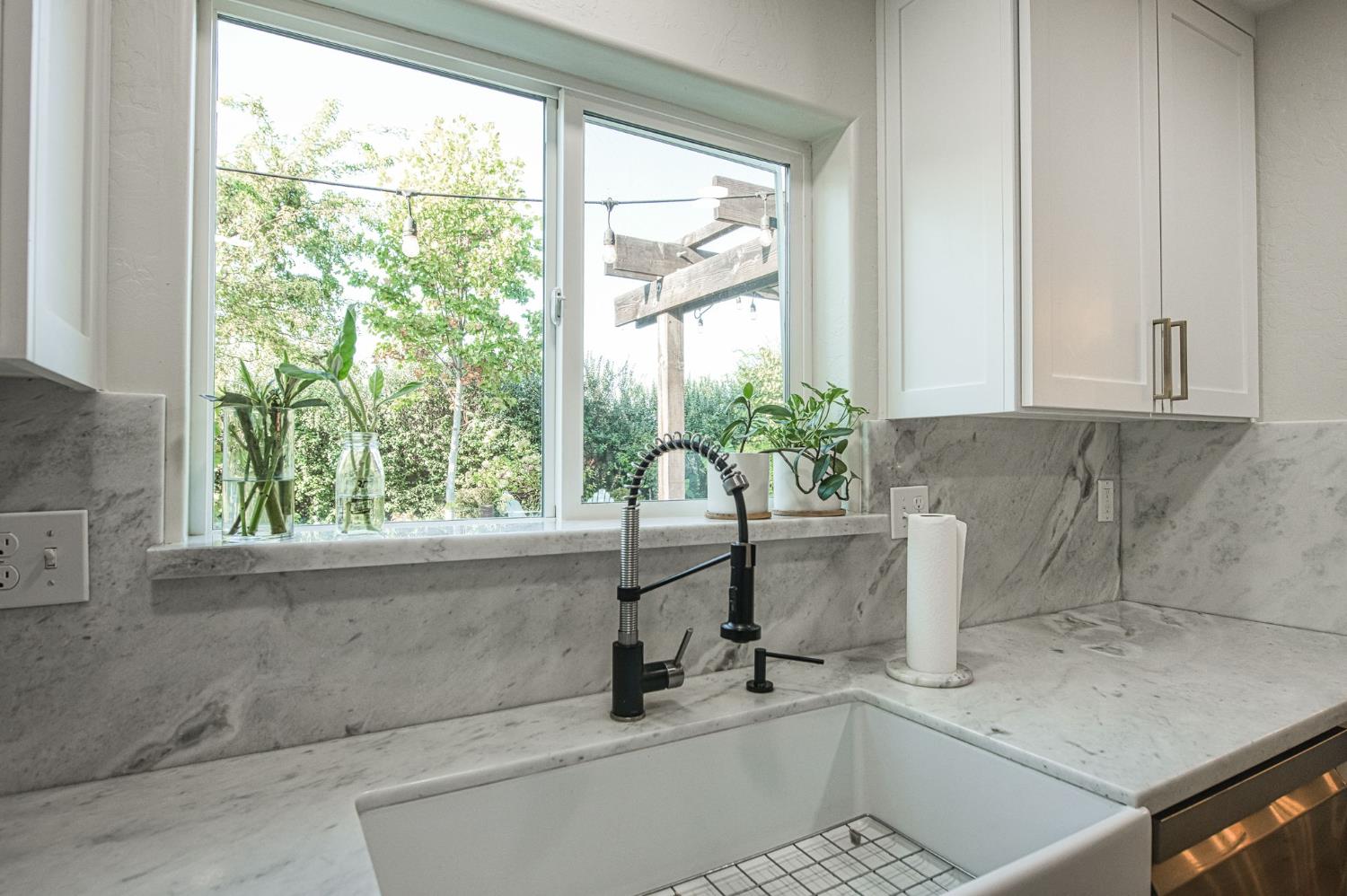 5855 East Platt Avenue Fresno, CA 93727 - Photo 34 of 57 a white bath tub sitting in a bathroom next to a window