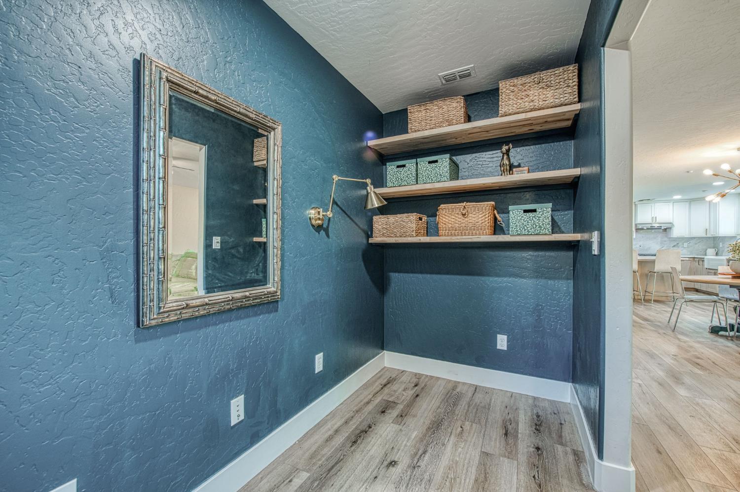 5855 East Platt Avenue Fresno, CA 93727 - Photo 40 of 57 a view of a hallway with cabinet