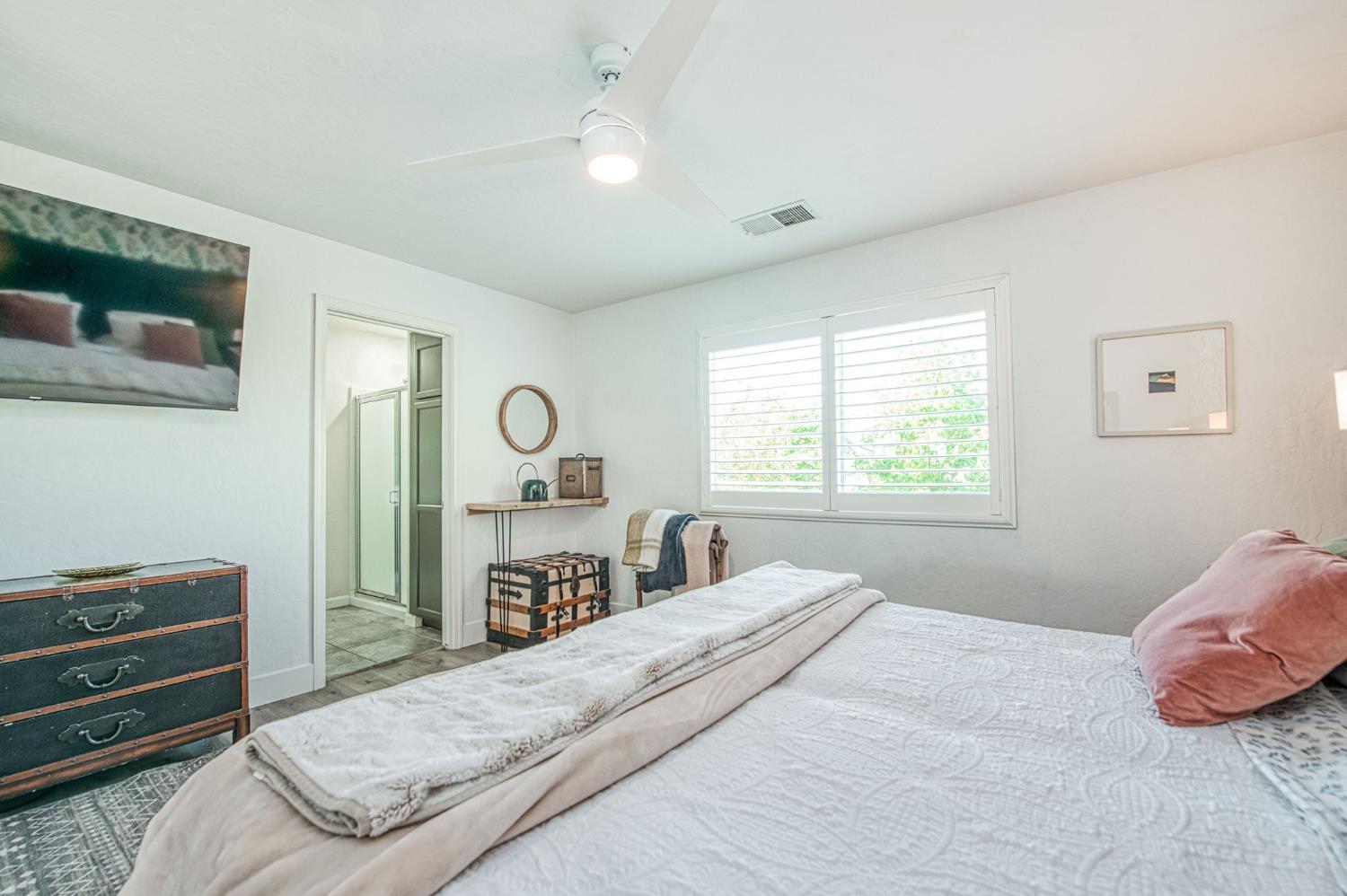 5855 East Platt Avenue Fresno, CA 93727 - Photo 43 of 57 a bedroom with a bed and a flat screen tv