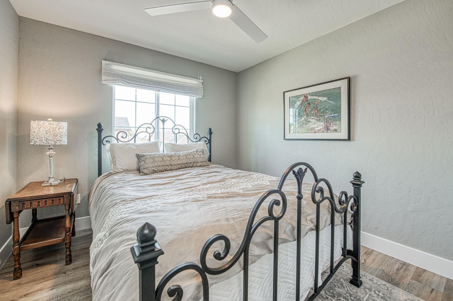 5855 East Platt Avenue Fresno, CA 93727 - Photo 51 of 57 a bedroom with a bed and a table